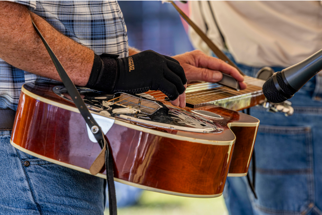 Man playing a resonator guitar.